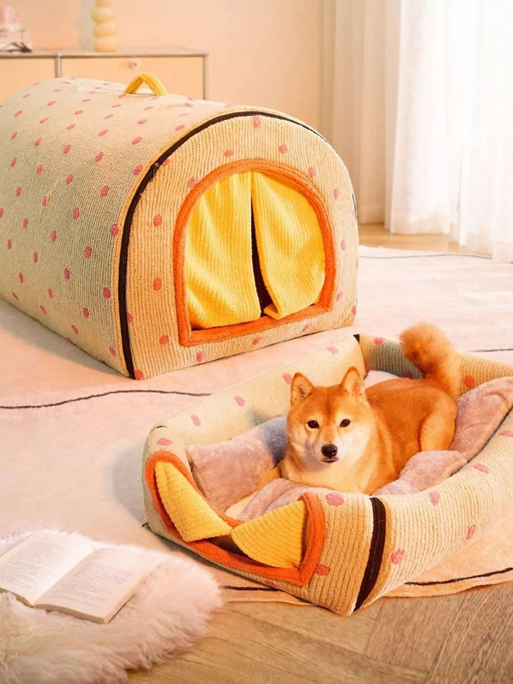 Dog lying in a cozy pet bed with a matching tent-like structure in a bright room.