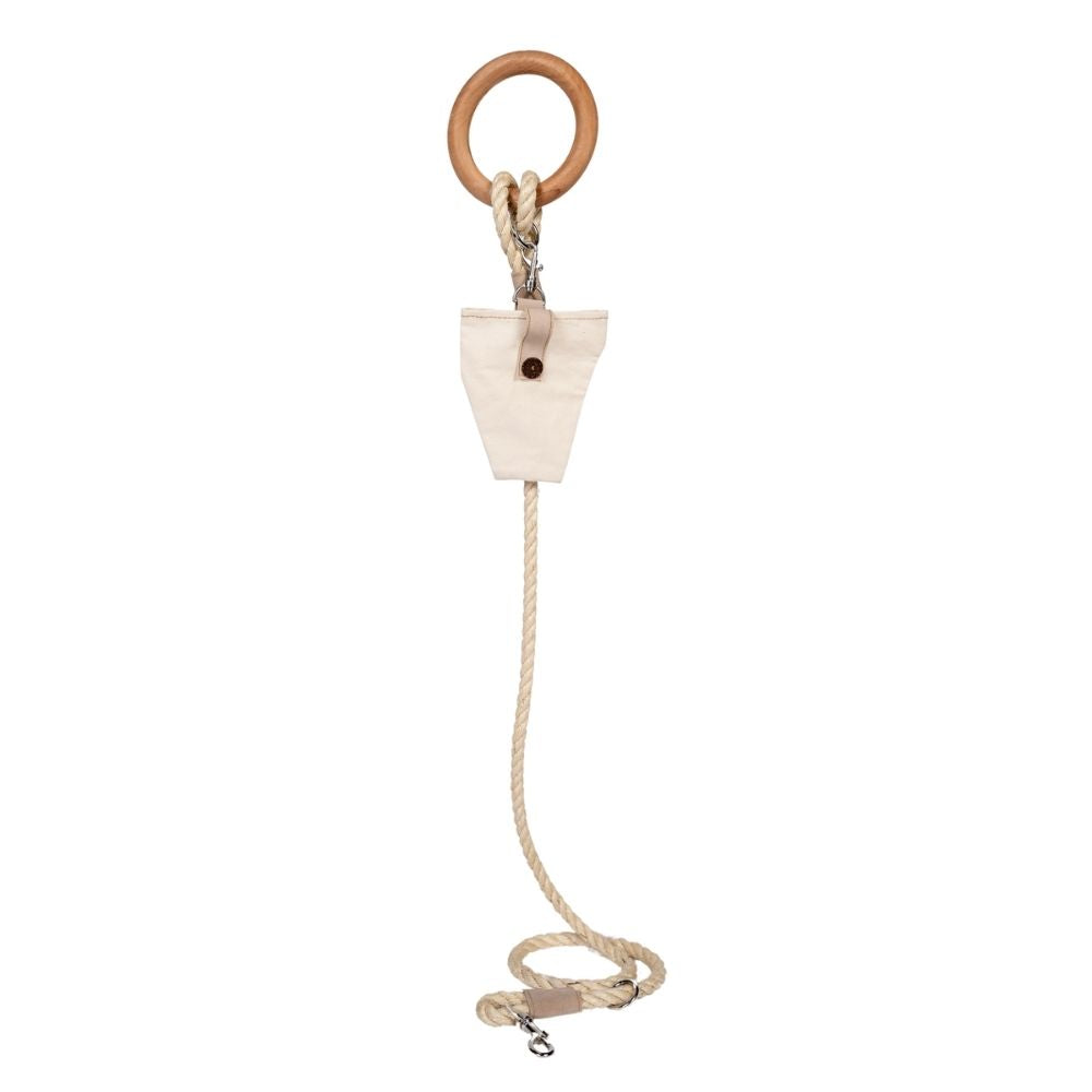 Wooden ring with a rope and triangular wooden block on a white background
